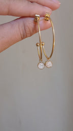 Hoop earrings with white natural stone pendant